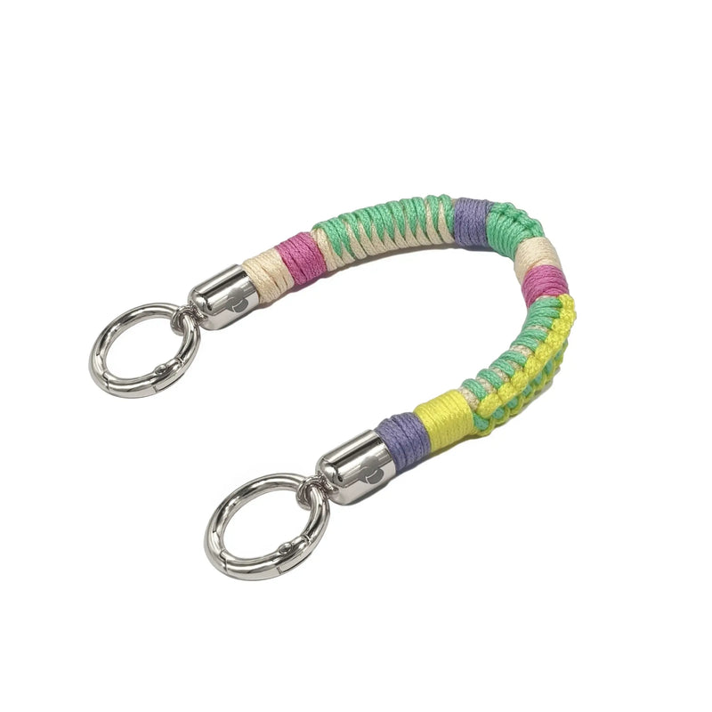 Mint Mambo colored braided TENCEL™ strap lying flat, featuring connectors for use as a phone charm or keychain.