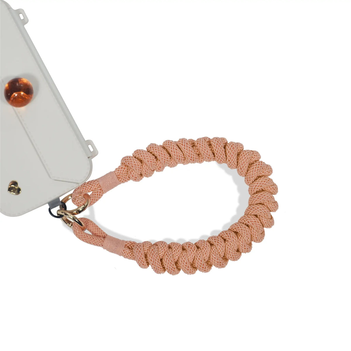 Safety wrist strap secured to phone port during movement in peach orange